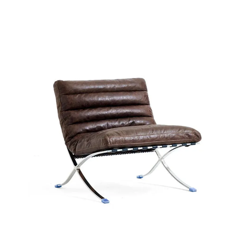 The ribbed lounge chair in brown, seen from the front corner