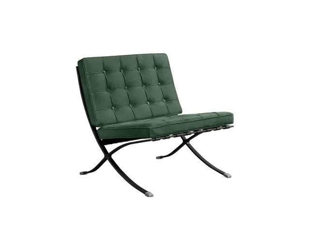 The Barcelona style lounge chair in forest green velvet, seen from the front corner