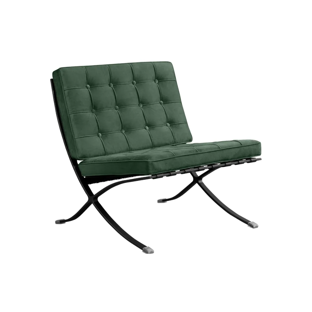 The Barcelona style lounge chair in forest green velvet, seen from the front corner