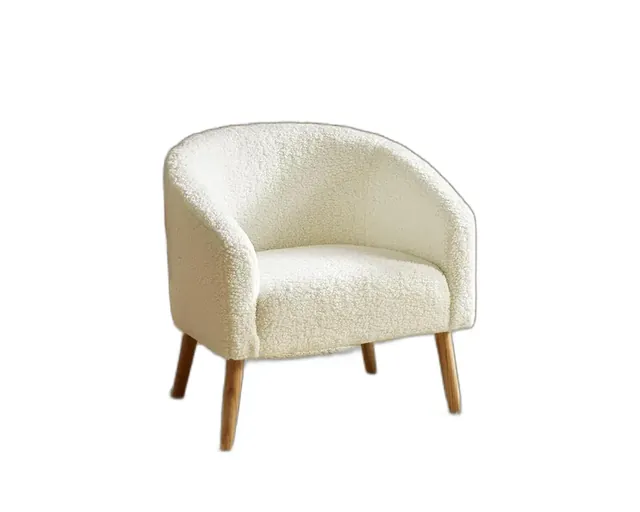 An ivory bouclé barrel accent chair with wooden legs