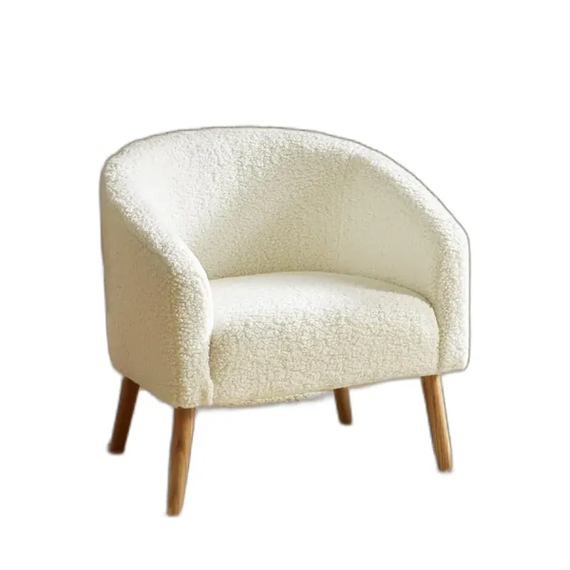 An ivory bouclé barrel accent chair with wooden legs