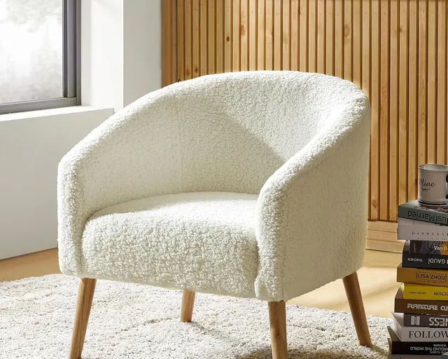 Single ivory bouclé barrel accent chair with wooden legs
