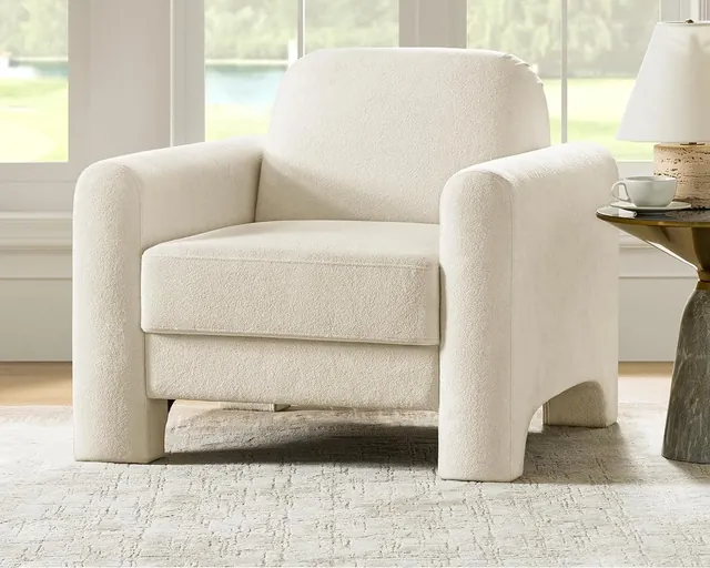 Curved ivory bouclé accent chair with fully wrapped armrests