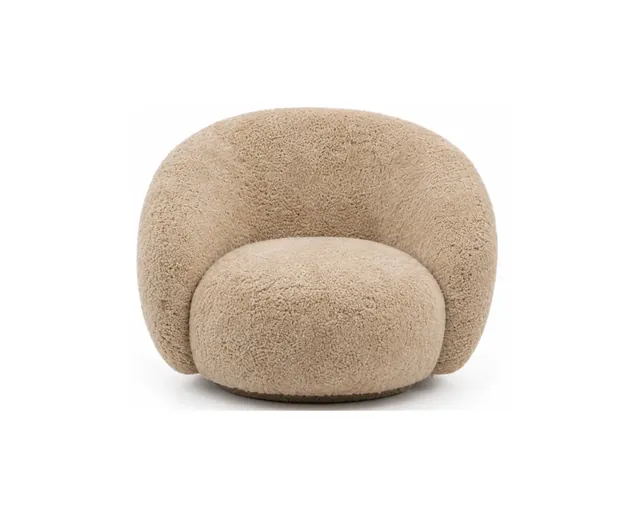 The sheepskin curved lounge chair in camel