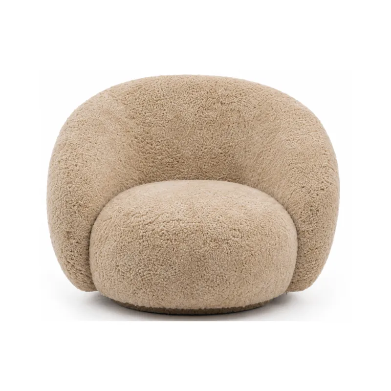 The sheepskin curved lounge chair in camel
