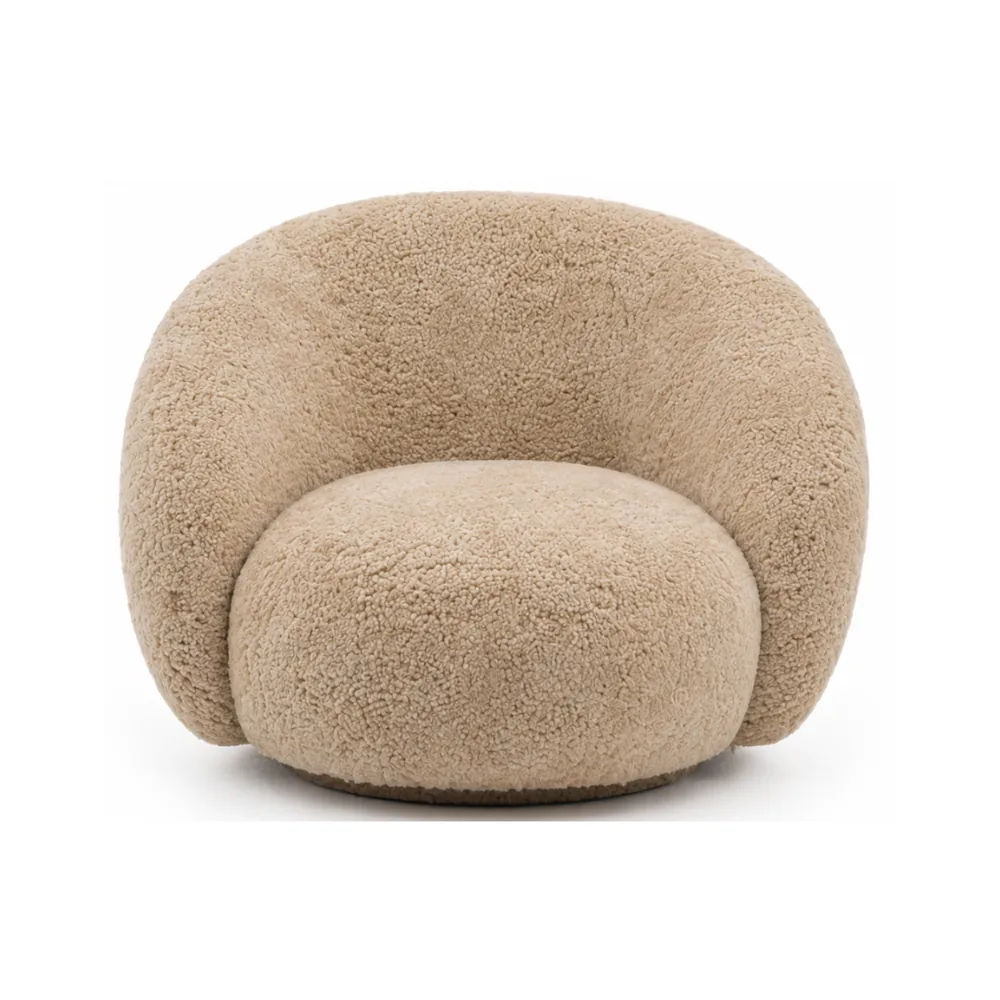 The sheepskin curved lounge chair in camel