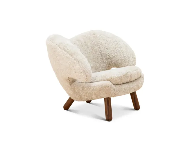 The sheepskin shell armchair in ivory