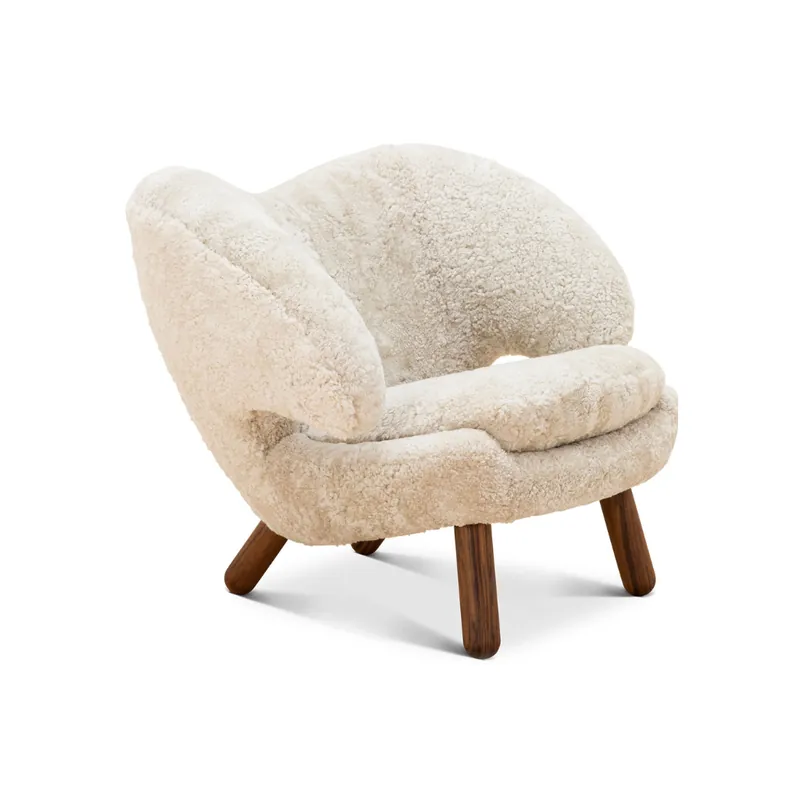 The sheepskin shell armchair in ivory