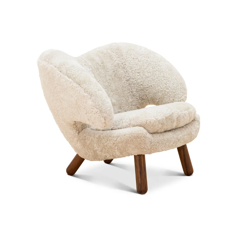 The sheepskin shell armchair in ivory